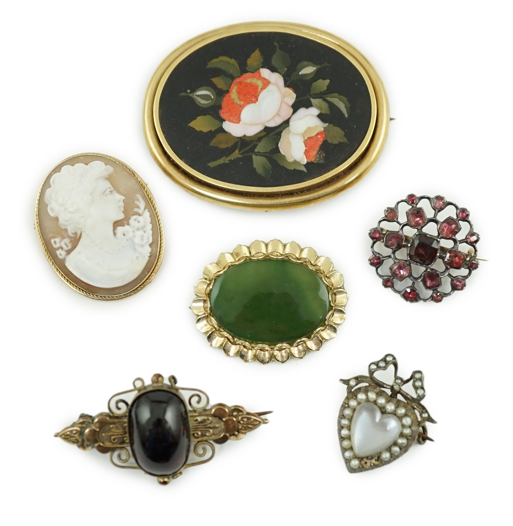 Six assorted late Victorian and later brooches